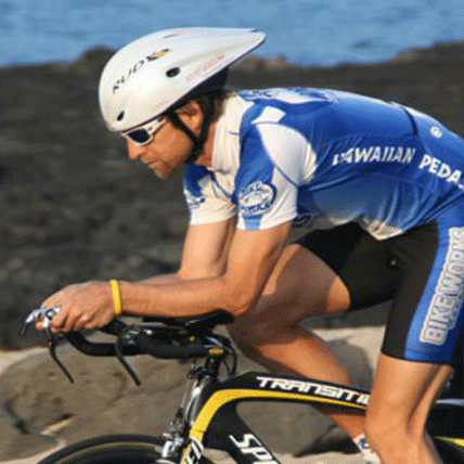 Triathlete in aero position on bike