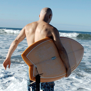 Tomas Anthony Surfer walking into ocean