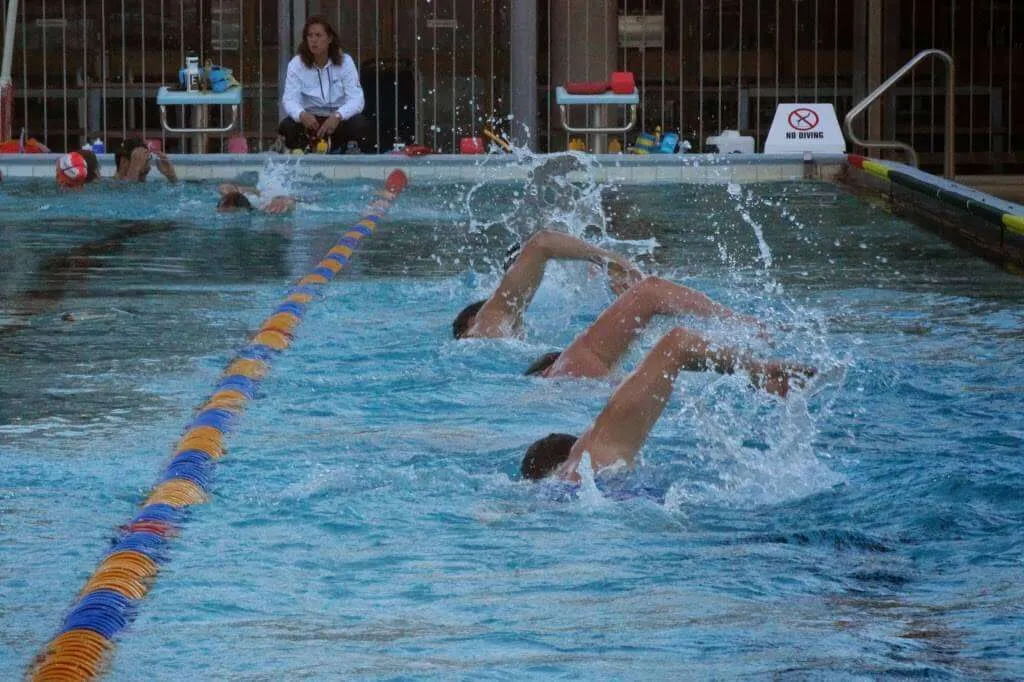 3 people swimming